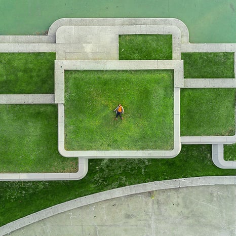 person-laying-on-grass-viewed-from-above